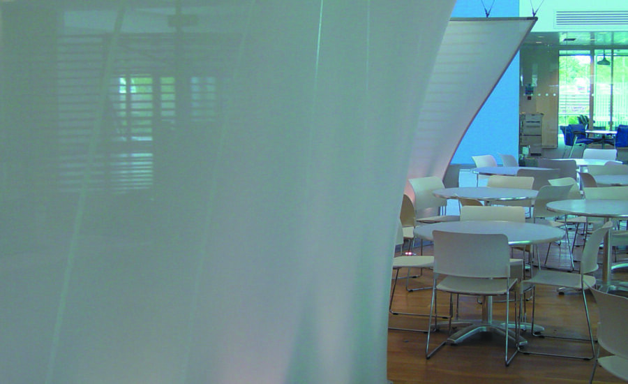 View along the sinuous curve of the BT Leavesden fabric screen in the staff restaurant