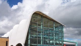 Barrel vaulted tensile fabric roof