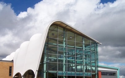 Barrel vaulted tensile fabric roof