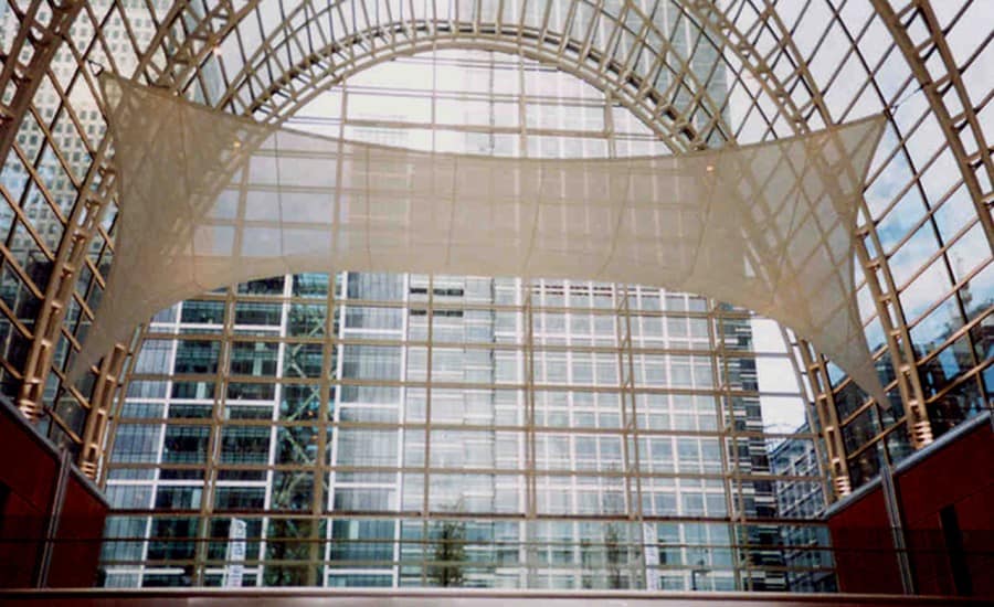 Tensile fabric feature in glass atrium