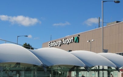 White fabric canopy protecting airport walkway