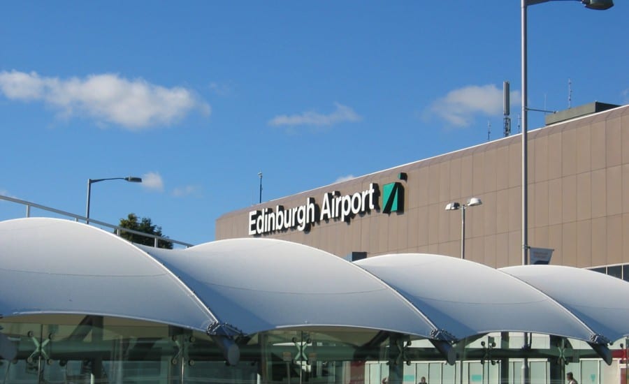 White fabric canopy protecting airport walkway