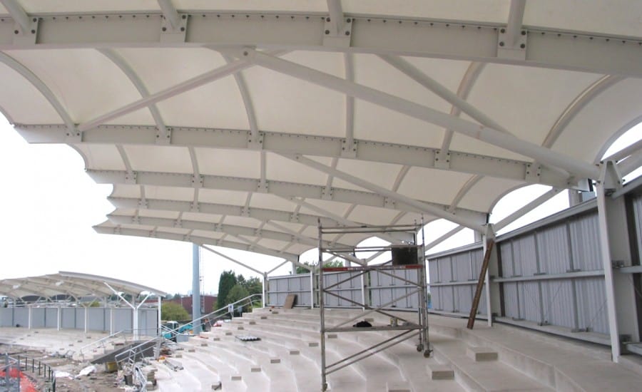 Canopies proving weather protection for athletics stadium