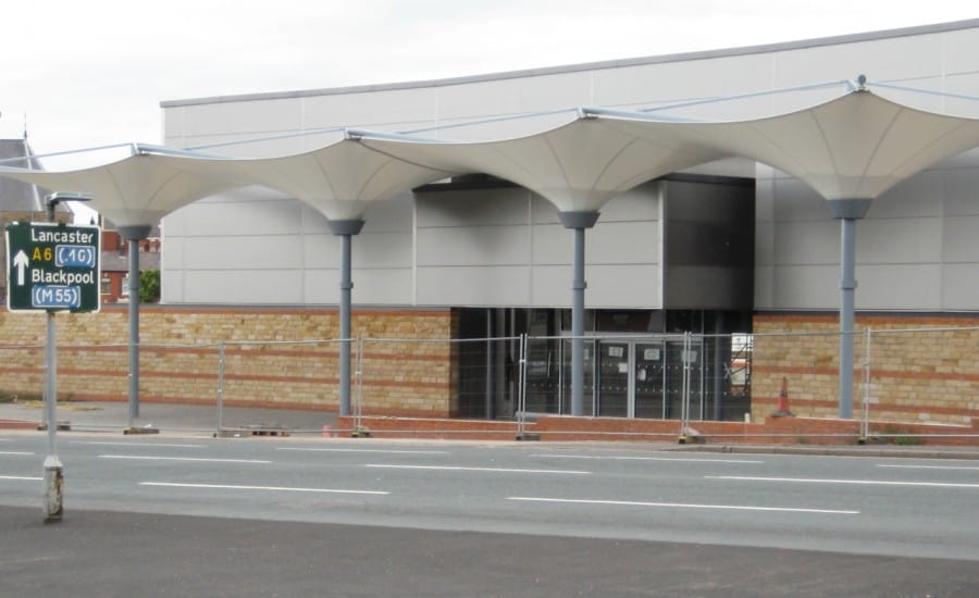 Umbrella canopies outside retail entrance