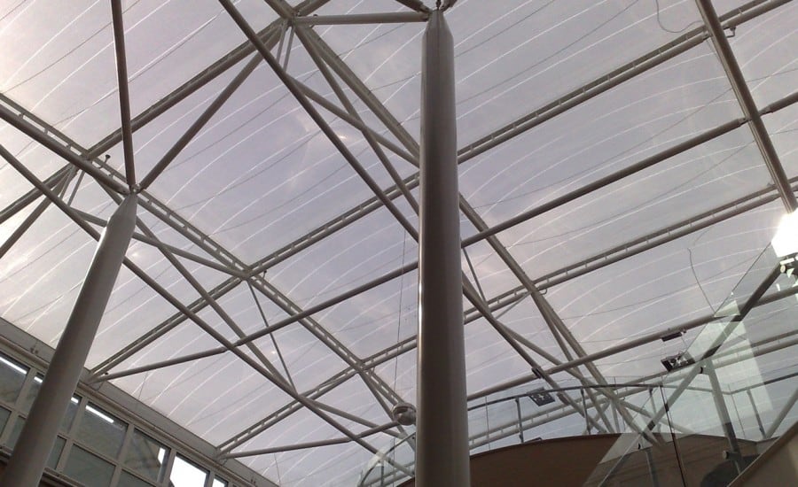 Tensile fabric roof protecting courtyard