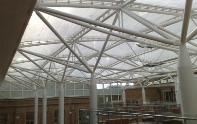 Tensile fabric roof covering school atrium