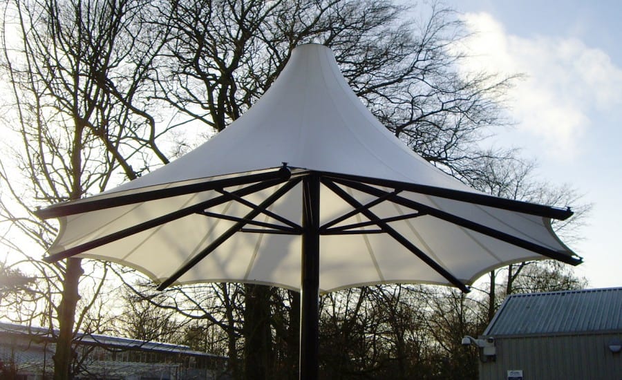 Tensile fabric umbrella for school courtyard