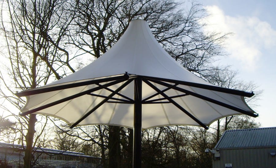 Tensile fabric umbrella for school courtyard