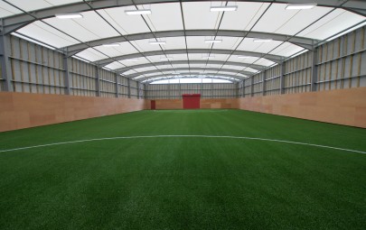 Tensile fabric roof structure over training ground