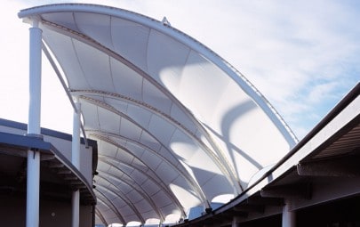 Tubular steel arches clad with PTFE