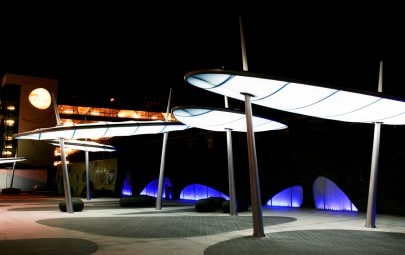 Fabric canopy structures with integrated lighting