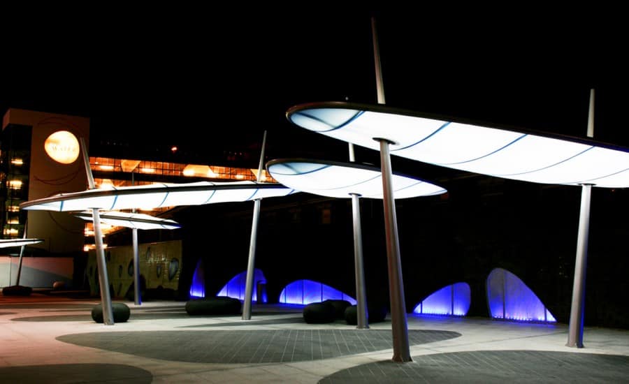 Fabric canopy structures with integrated lighting