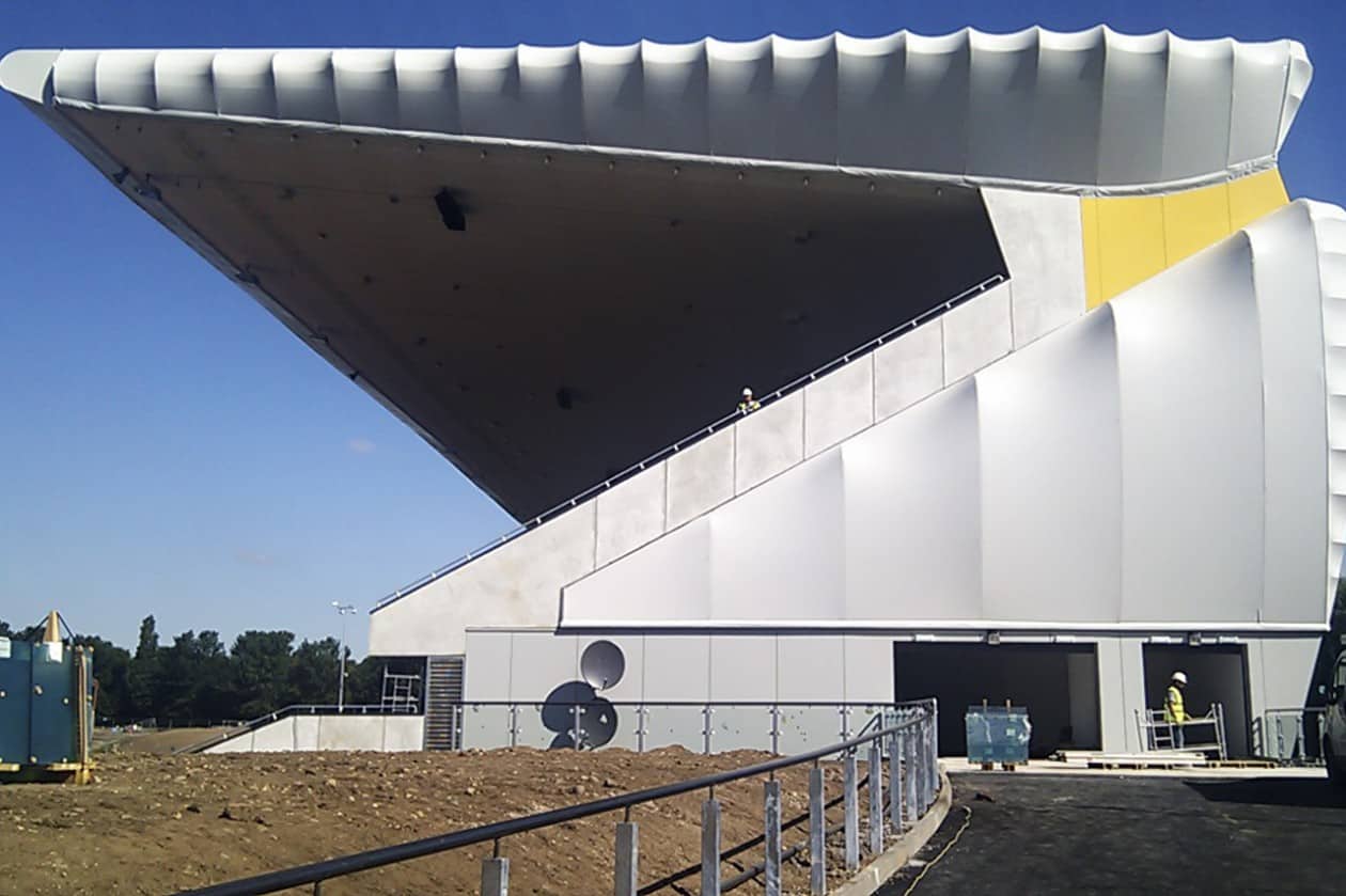 Tensile fabric cladding for athletics stadium - Architen Landrell