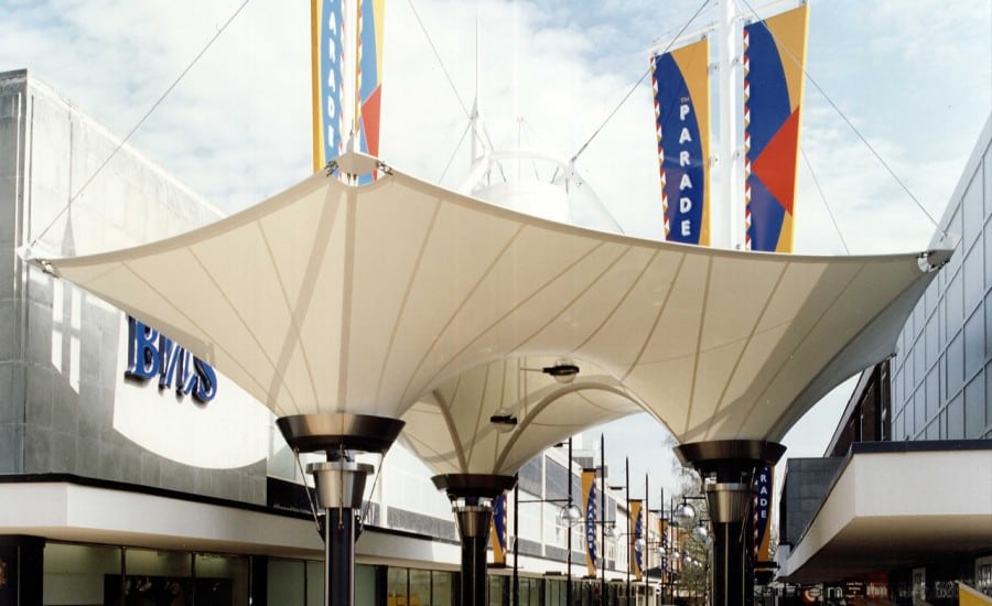 Inverted fabric cones providing weather cover in shopping centre