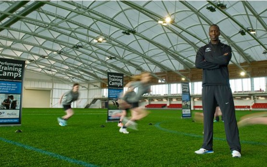 Fabric roof structure over sports training ground