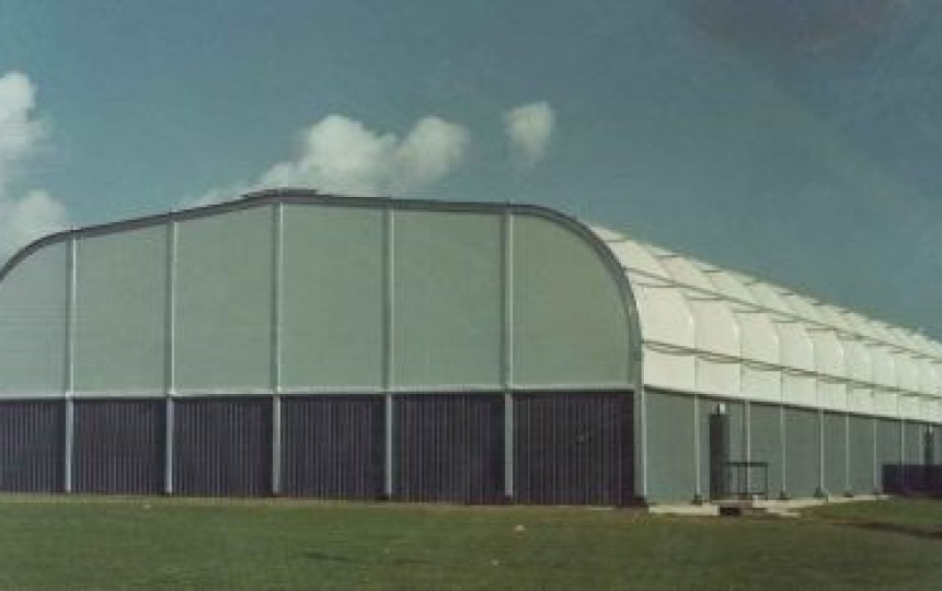 Fabric cladding to a portal frame system