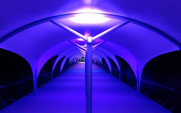 Walkway canopy at night with lights